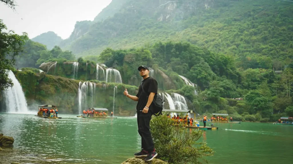 A beautiful wide view of Ban Gioc Waterfall with green trees