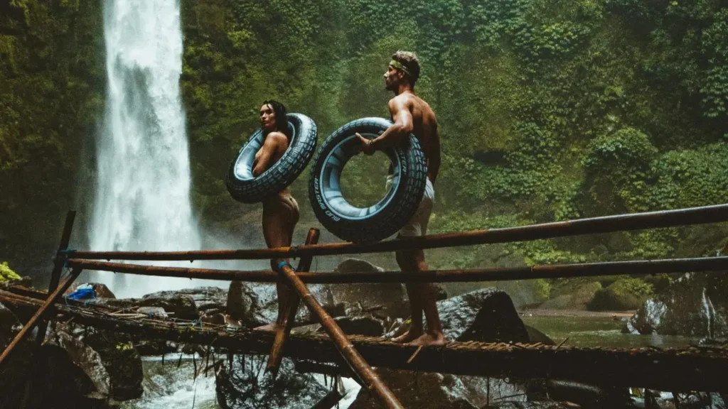 A small wooden and bamboo bridge over a river in Bali jungle