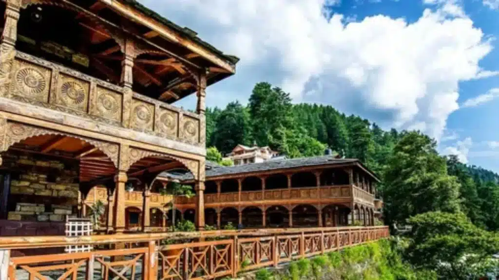 The historical Naggar Castle made of stone and wood with a view of Kullu Valley.