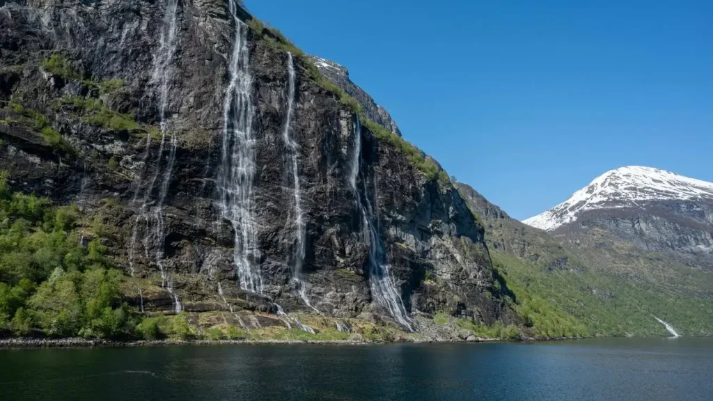 A majestic front view of the Seven Sisters Waterfall cascading down the limestone cliffs in Cherrapunji