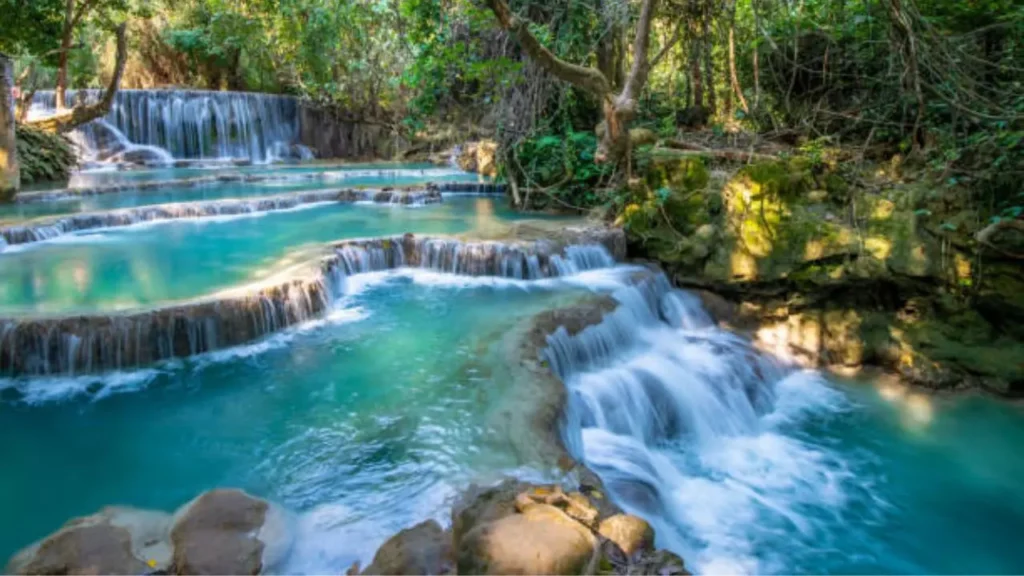Beautiful milky blue water of Kuang Si Waterfall in Luang Prabang Laos