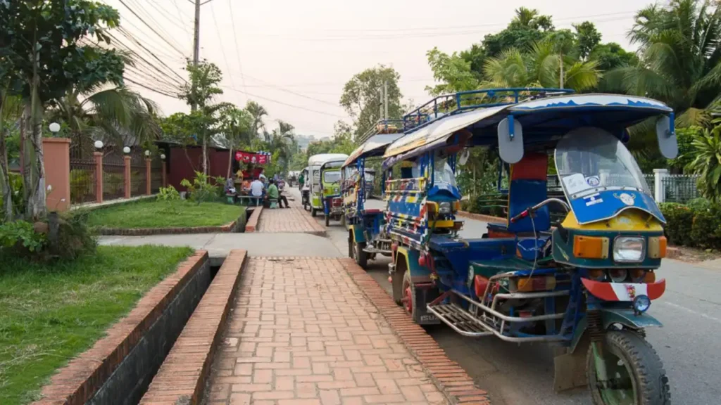 A colorful local Tuk-tuk ride to Kuang Si Waterfall