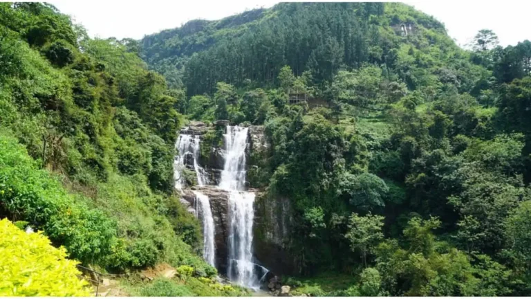 Full scenic view of Ramboda Waterfall in Sri Lanka surrounded by green mountains